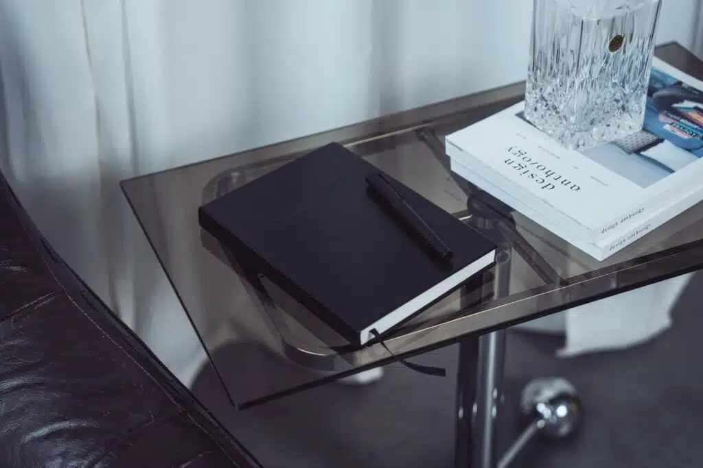 TIMEMASTER notebook placed on a table with a pen
